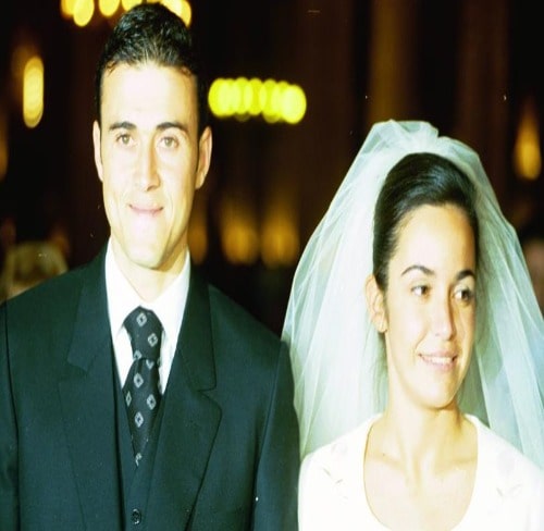 Wedding Picture of Elena and her Husband Luis wearing black coat and white gown